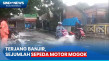 Nekat Terjang Banjir,...