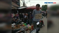 Pencopet Berkalung Kardus...