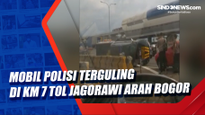 Mobil Polisi Terguling...