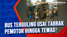 Bus Terguling Usai Tabrak...