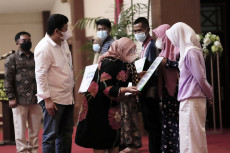 Menaker Hadiri Sosialisasi...