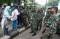 Polisi dan TNI Bubarkan...