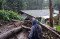 Warga Bersihkan Rumah...