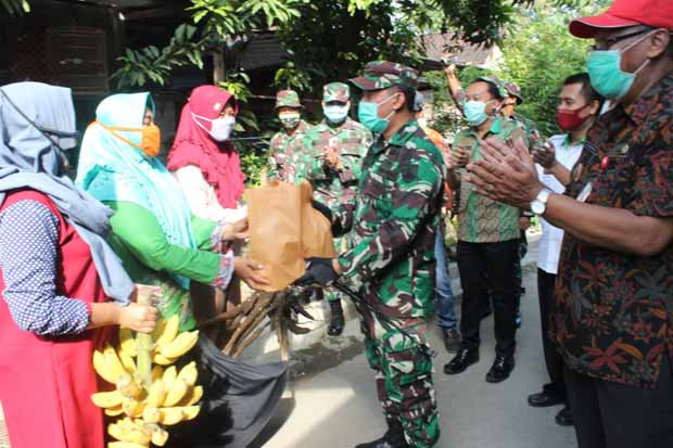 TMMD Bantu Pemkot dalam...