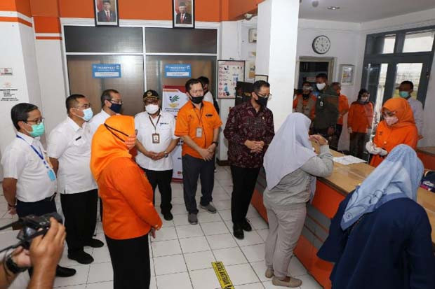 Kemensos dan PT Pos...