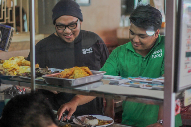 Grab Perluas Akses Pasar...