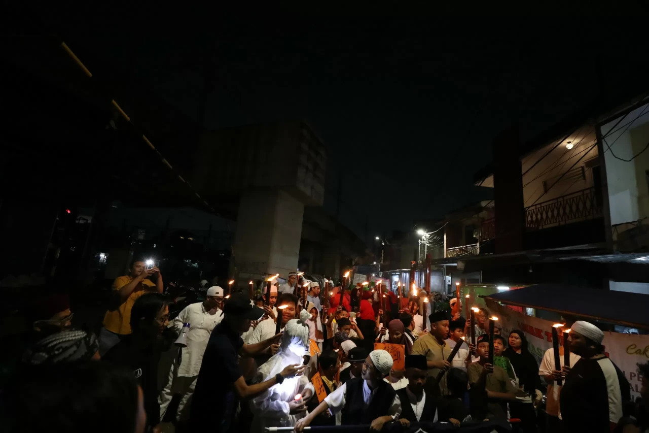 Pawai Obor Memperingati...