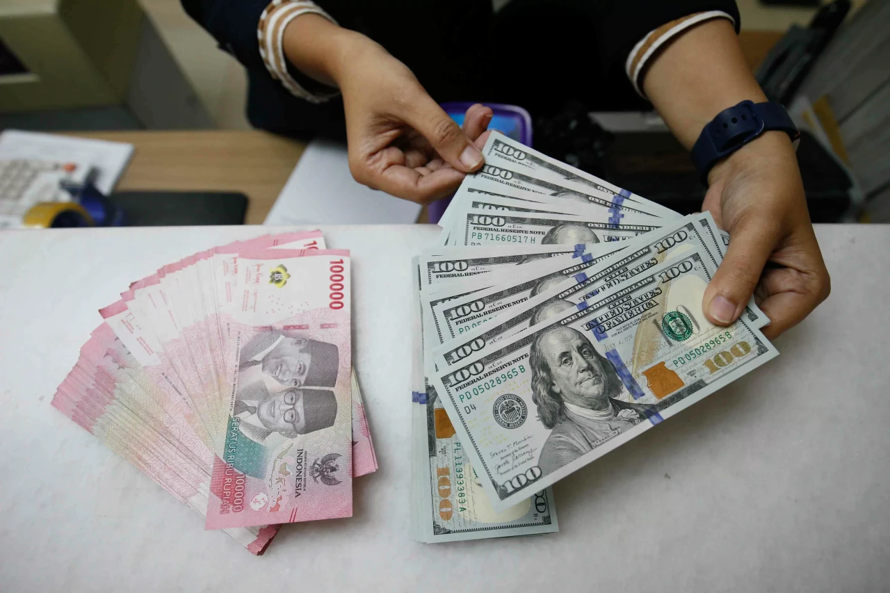 Rupiah Ditutup Melemah...