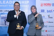 Dewi Aryani Suzana dan...