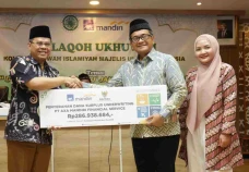 AXA Mandiri Salurkan...