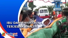Terjebak Banjir, Petugas...