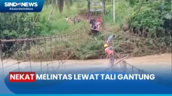 Jembatan Penghubung Terputus Akibat Banjir, Warga  Desa Pulau Bayur Nekat Melintas Lewat Tali Gantung