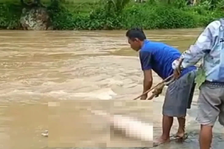 Pasutri Hanyut di Sungai...