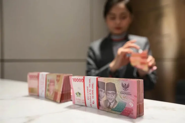 Nilai Tukar Rupiah Versus...