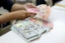 Rupiah Tertekan Sore...